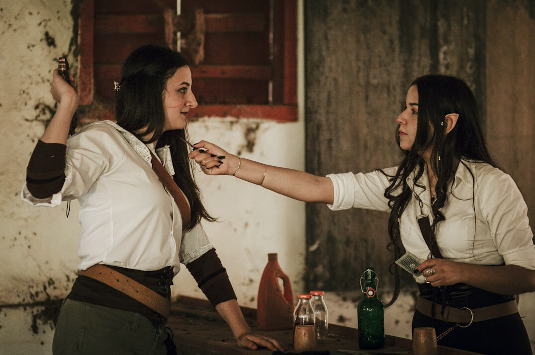 Two colleagues role-playing a negotiation exercise